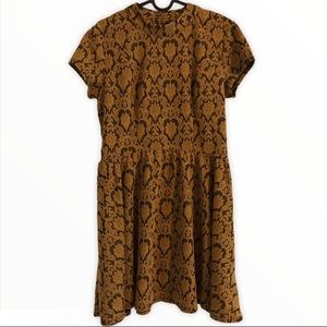 Gold and black baroque print dress.